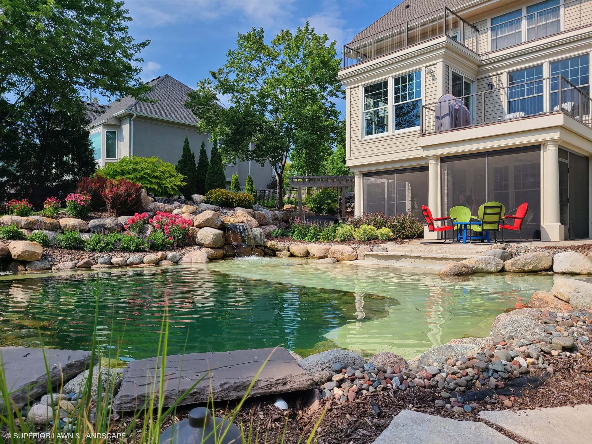 superior-lawn-landscape-outdoor-living-031-back-yard-boulder-pool.jpg