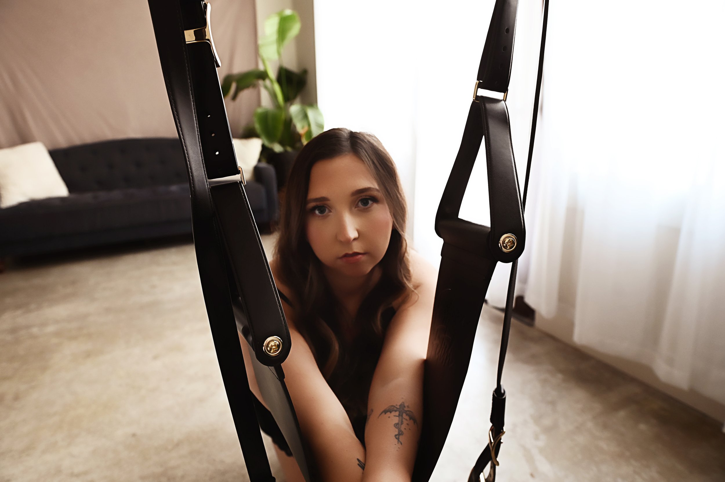 close up boudoir photo of woman in black lingerie posing in studio Squarespace Description: Close up boudoir image in Shreveport studio featuring black lingerie and soft natural lighting for a clean intimate look