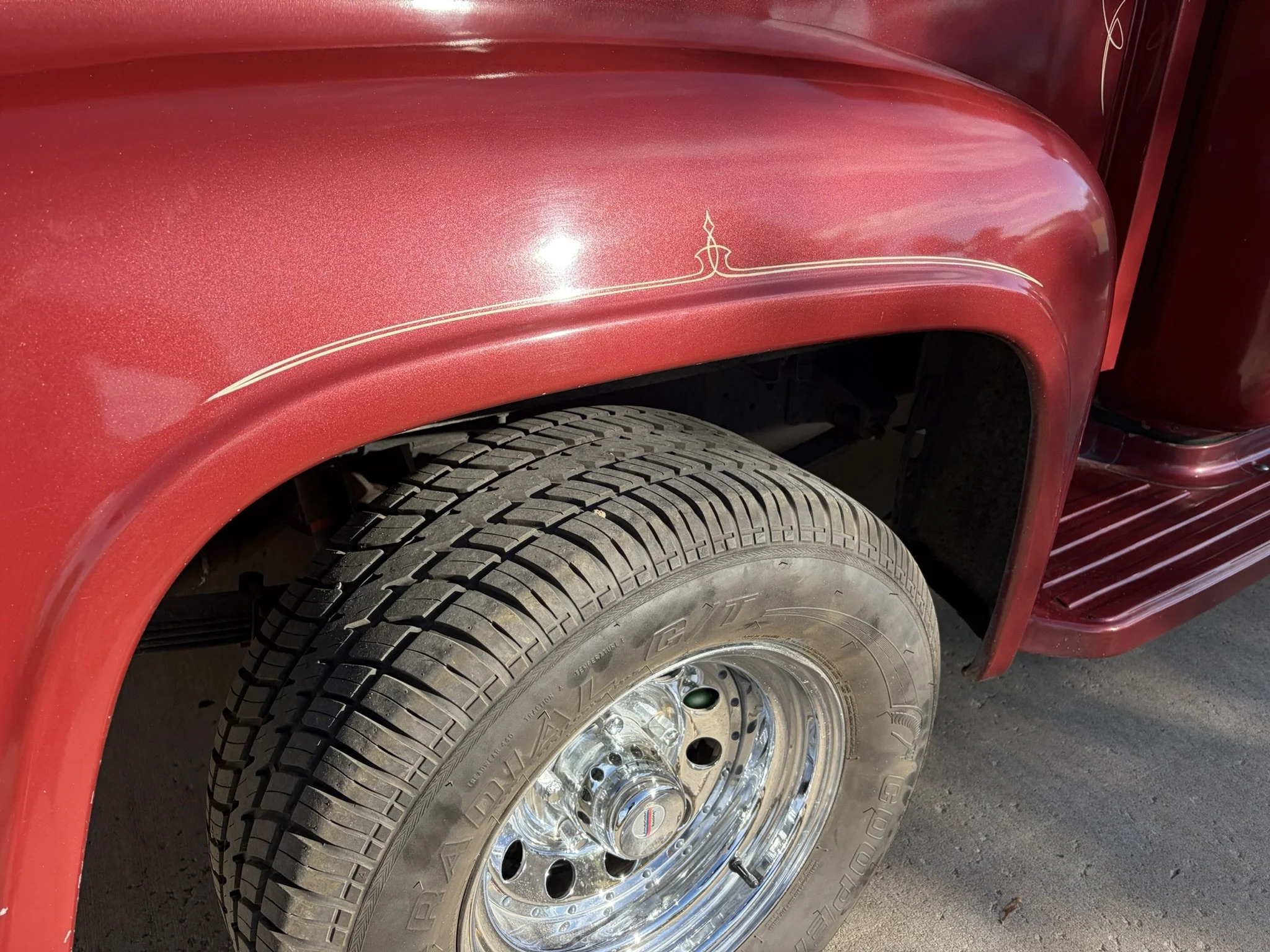 Maroon 1956 Ford F100 pickup with ivory pinstriping by Matt Beckner.