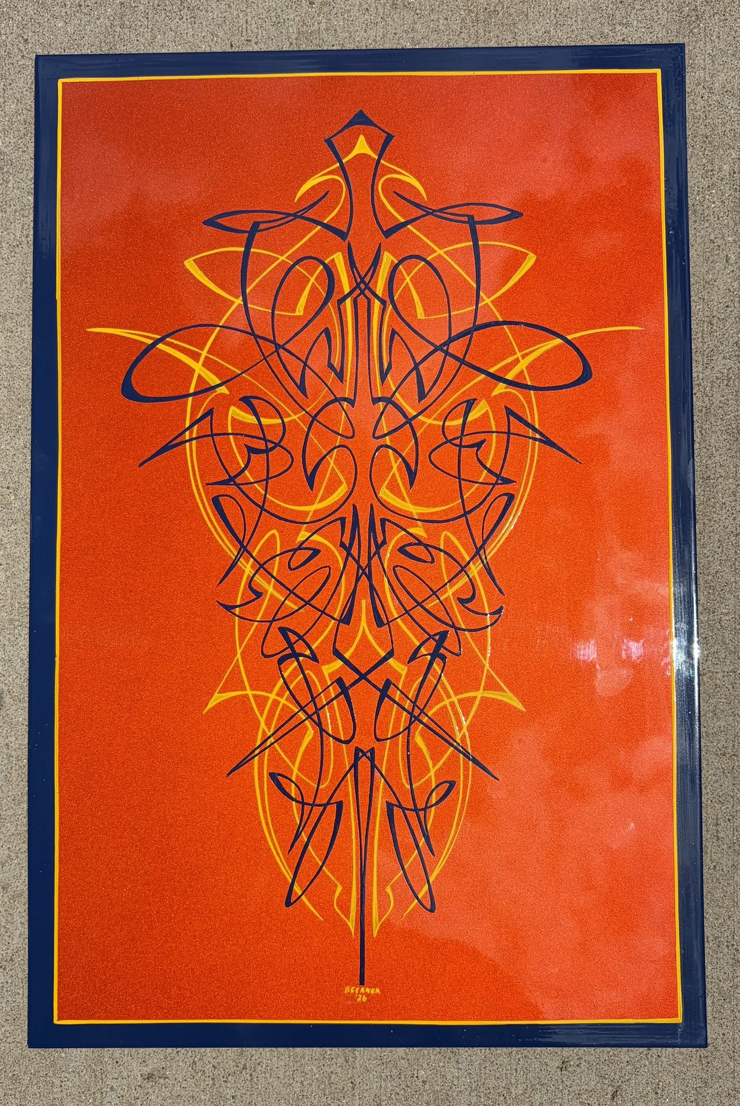 Orange metal-flake panel dripping with yellow and dark blue pinstriping by Matt Beckner.