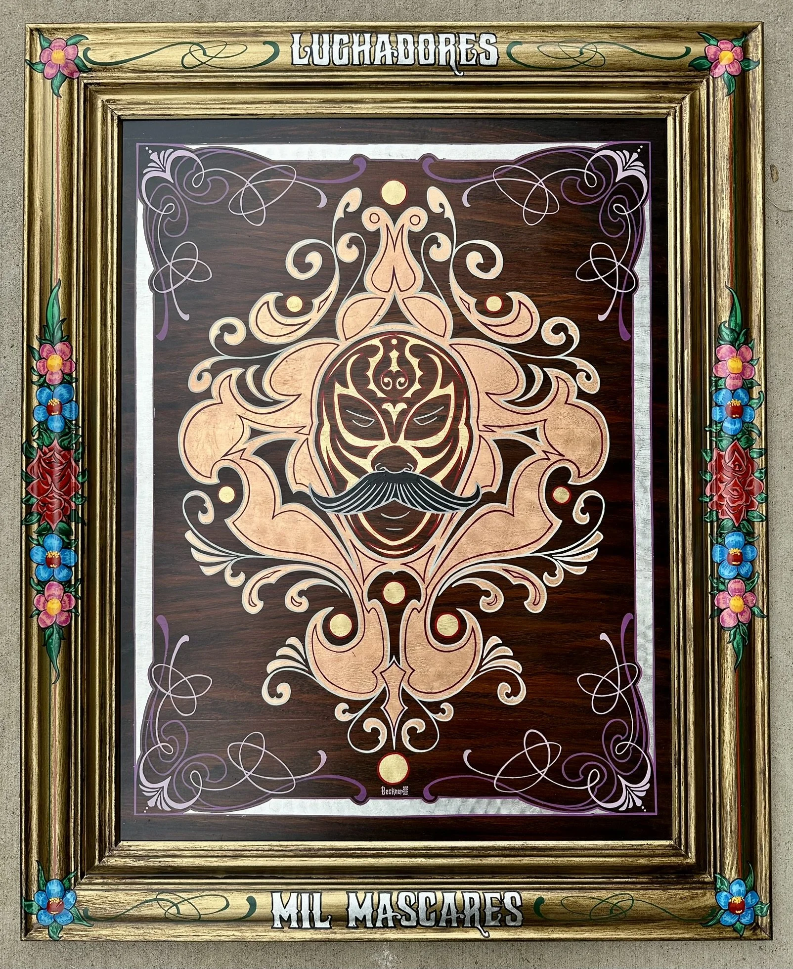 Luchadores - Mil Mascares means Wrectling - Thousand Masks. Art piece done for Luchas Tacos in Alamosa, Colorado. Lucha mask painted in gold leaf with elaborate painted background and frame.