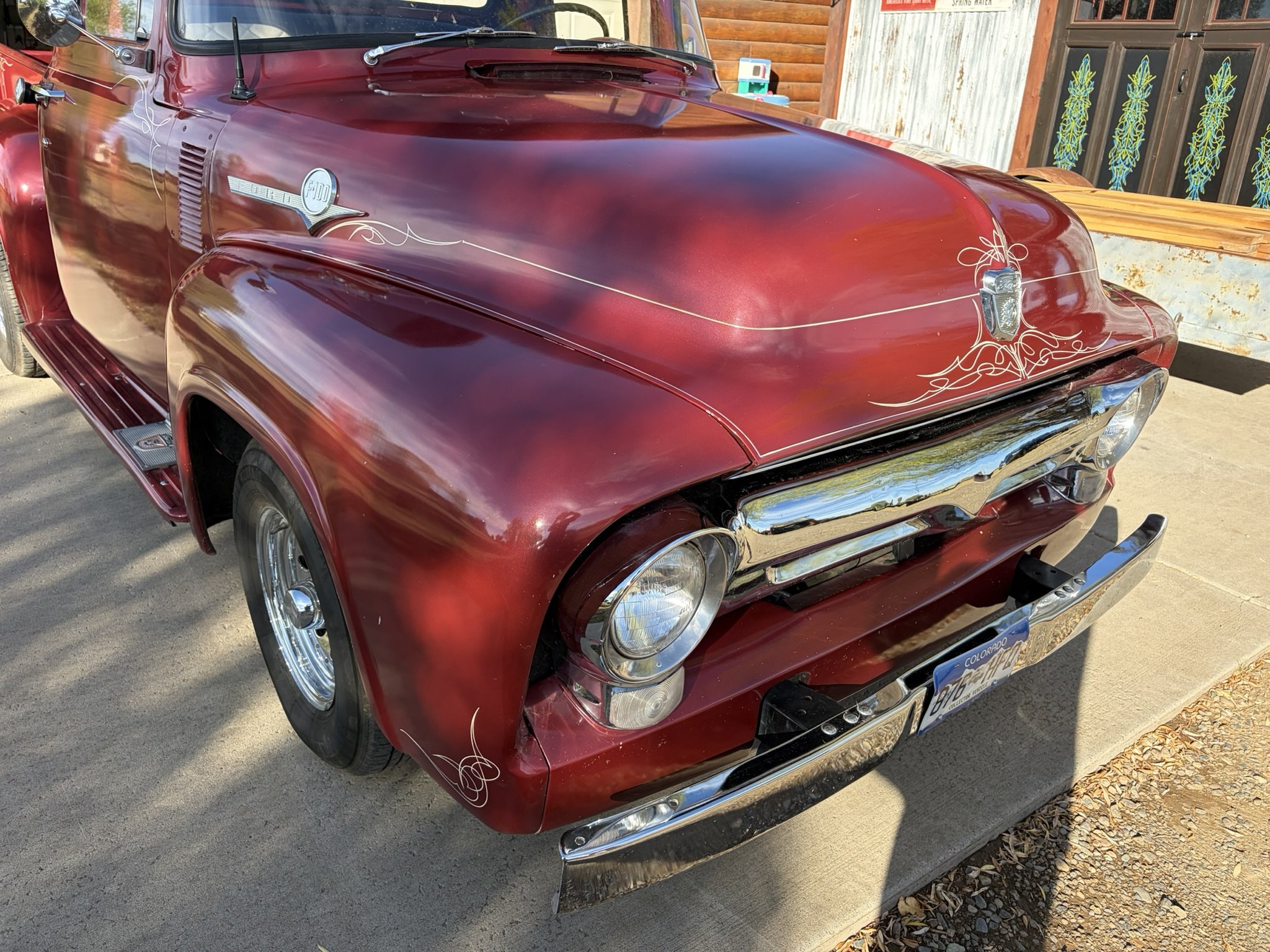 Maroon 1956 Ford F100 pickup with ivory pinstriping by Matt Beckner.