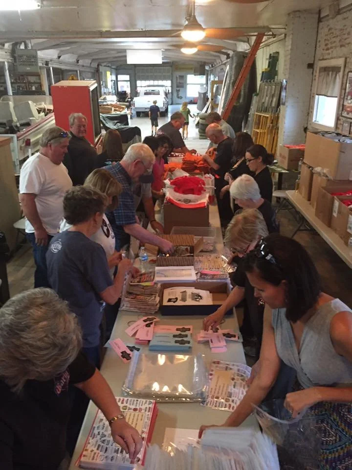 Filling goody bags at Ion Graphics for the Early Iron show 2015
