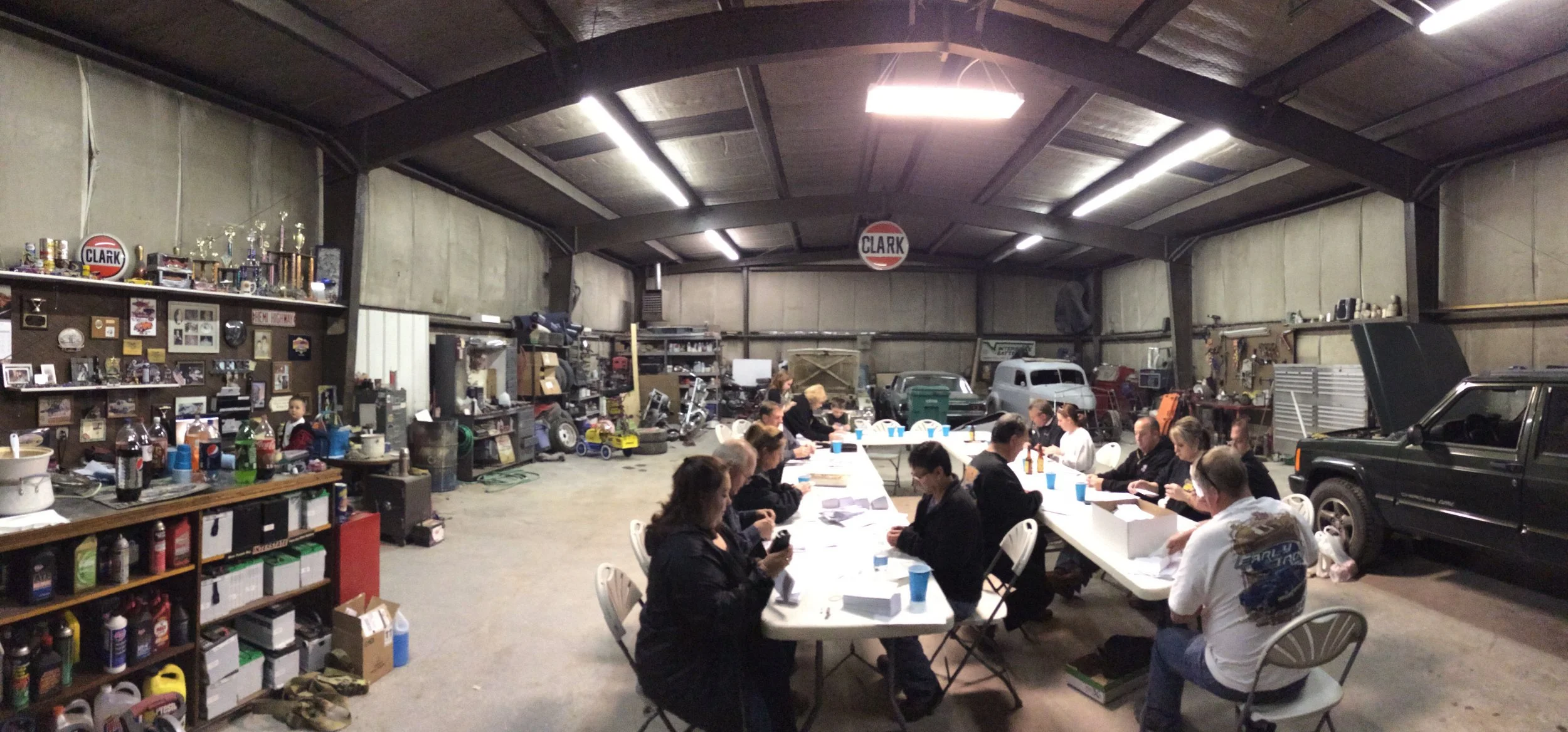 Early Iron Club gathered at Clark Auto for a meeting