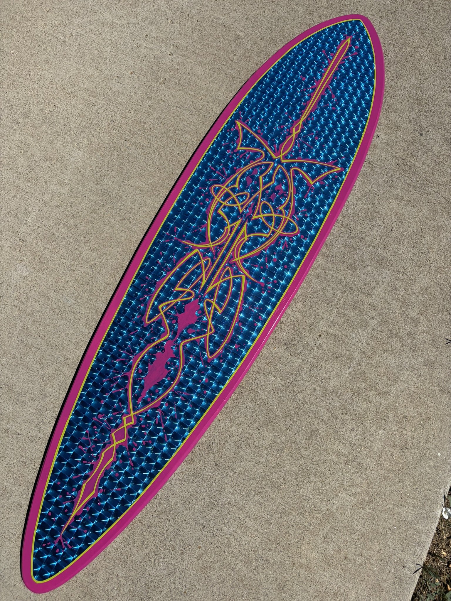 Pintail longboard with blue, prismatic background topped off with magenta and lime green pinstriping. Painted by Matt Beckner.