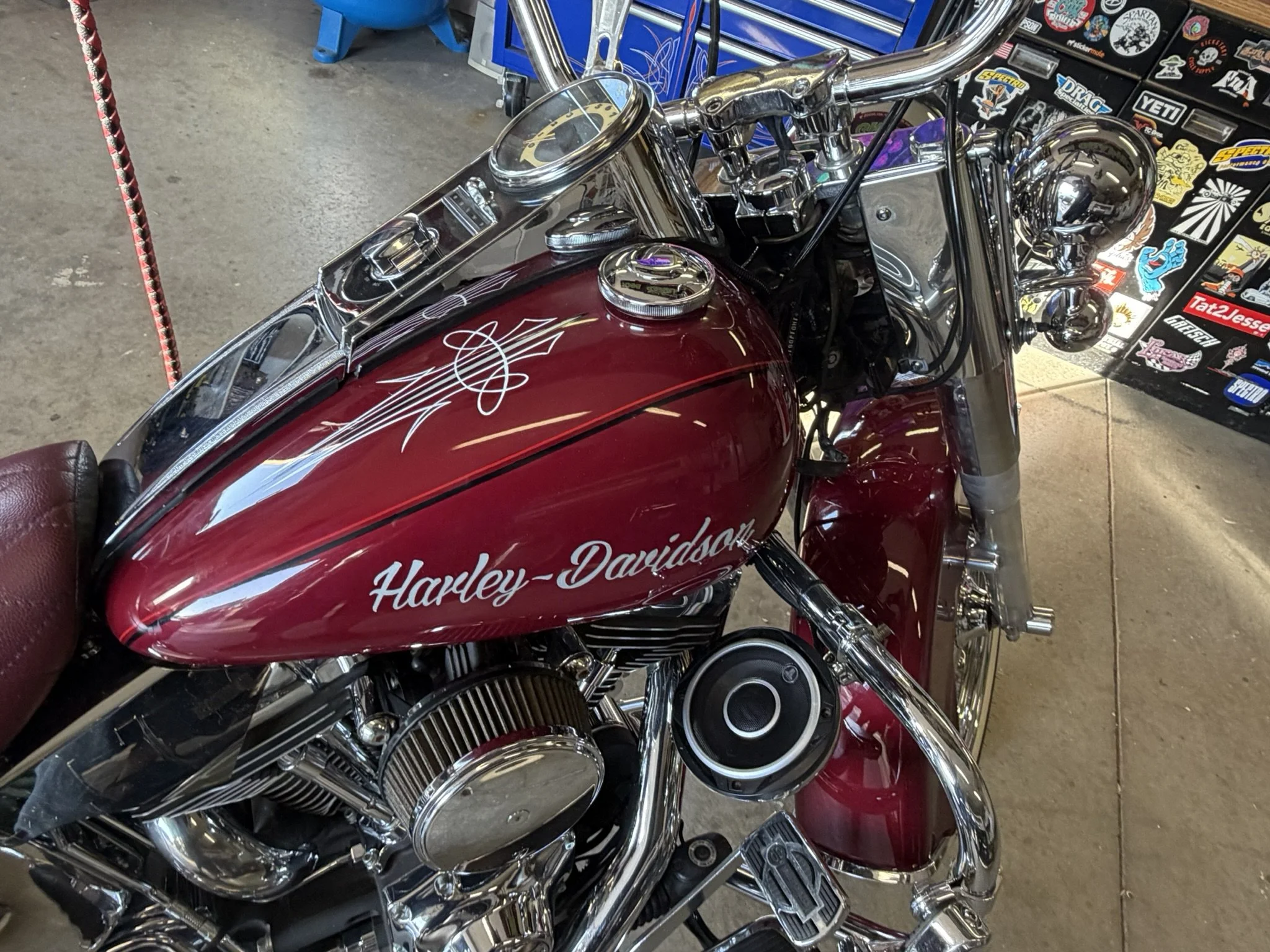 Maroon Harley Davidson with silver and white pinstriping and hand lettered "Harley-Davidson" tank by Matt Beckner.