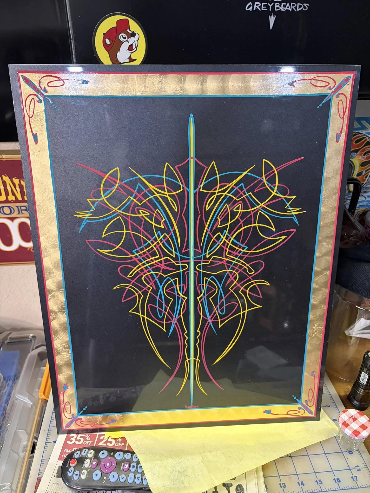 Black panel with rubine red, kansas city teal, and chrome yellow pinstriping with a spun gold leaf border painted by Matt Beckner