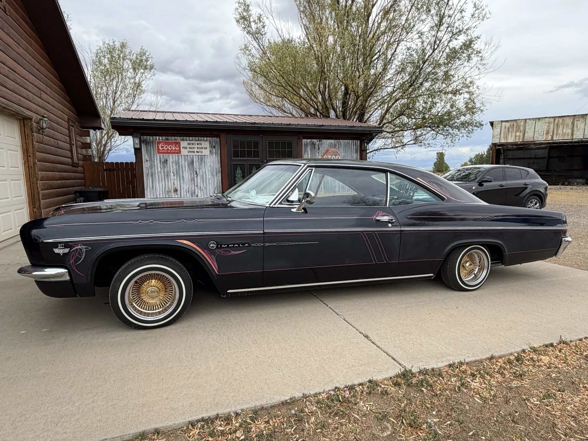 1966 Impala pinstriped in magenta, silver with copper leaf by Matt Beckner