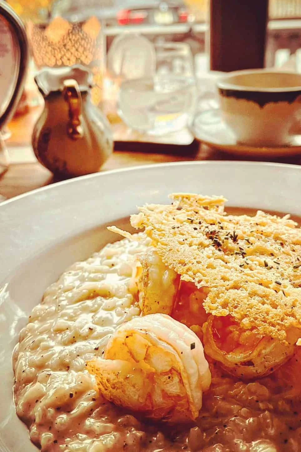 A plate of risotto and shrimp.