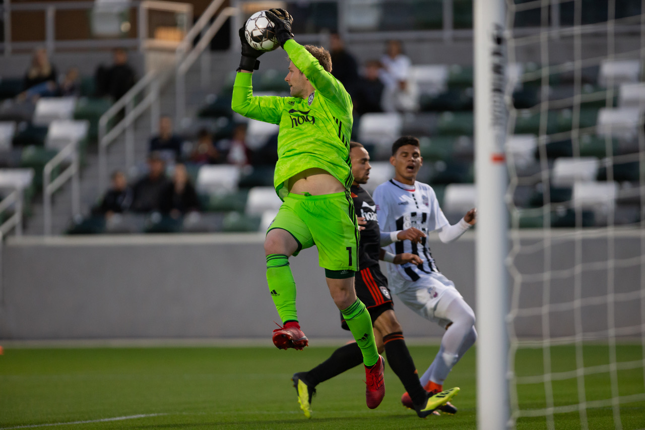 Orange County SC goal keeper Patrick McLain makes a save against Colorado Springs Switchbacks FC | Photo courtesy of Orange County SC