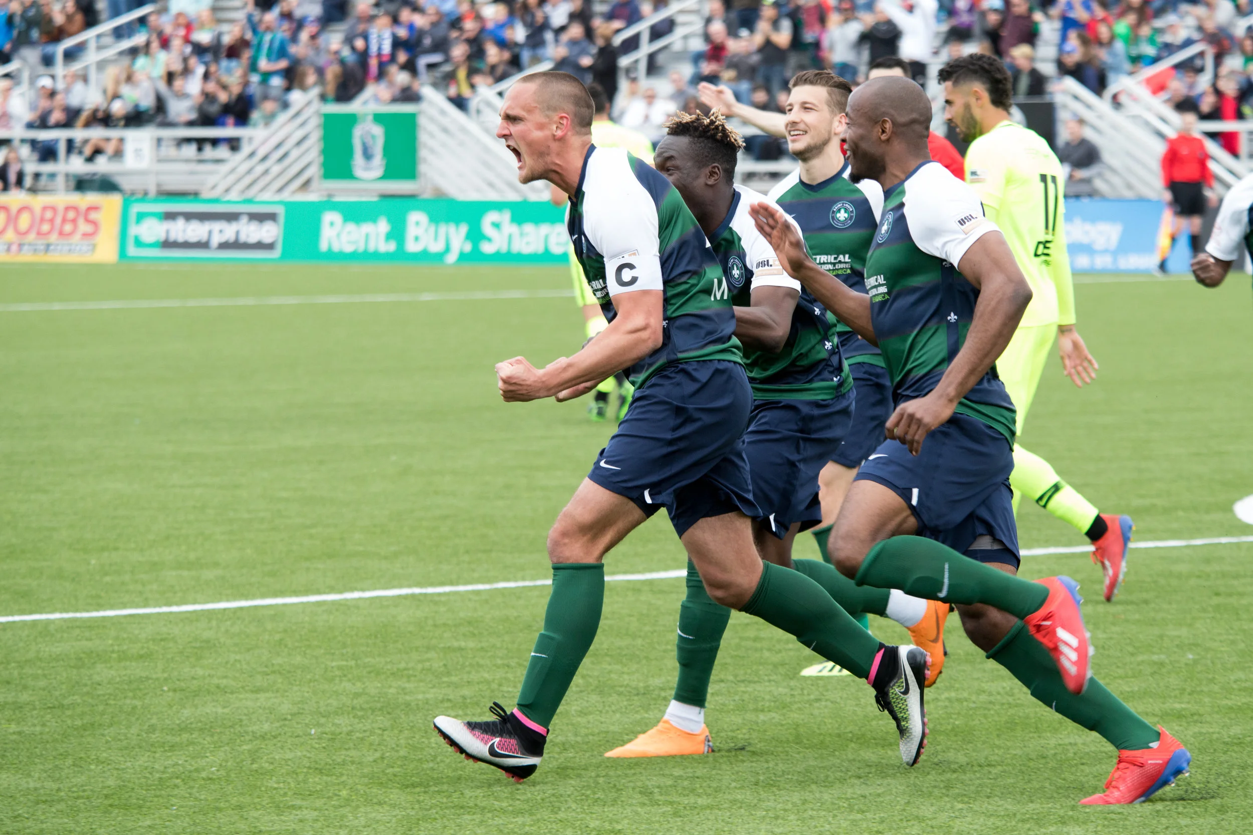 Saint Louis FC captain Sam Fink celebrates with teammates. | Photo courtesy of Saint Louis FC
