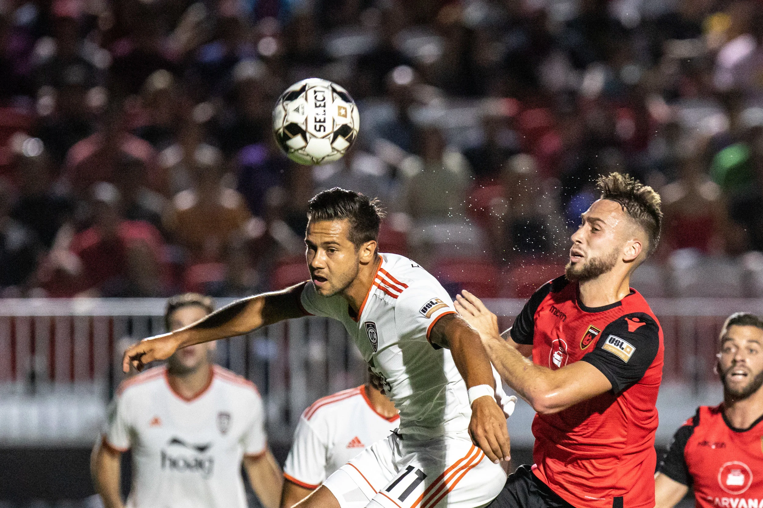 Orange County SC’s Harry Forrester gets his head on the ball against Phoenix Rising FC. | Photo courtesy of Michael Rincon/PHXRisingFC.com