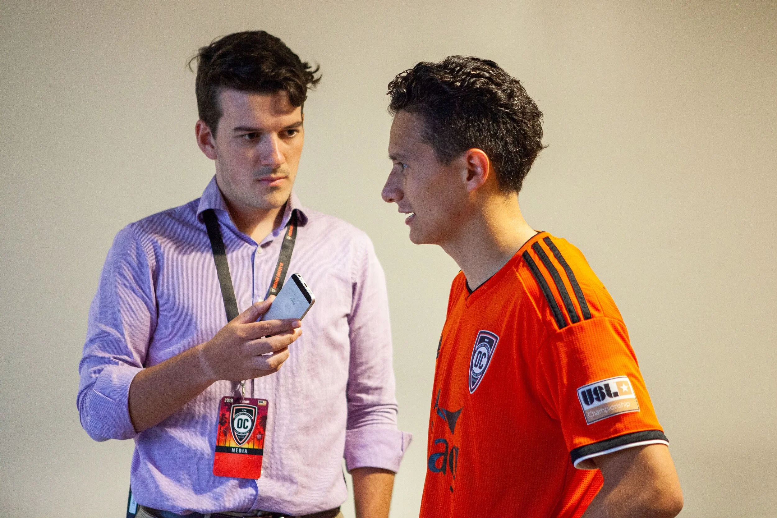 Orange & Black’s Dylan interviews Orange County SC midfielder Daniel Crisostomo after he scores his first professional goal. | Photo courtesy of Orange County SC/Liza Rosales