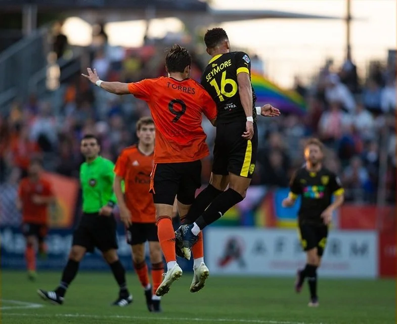 Cubo Torres battles Seymore for an aerial ball