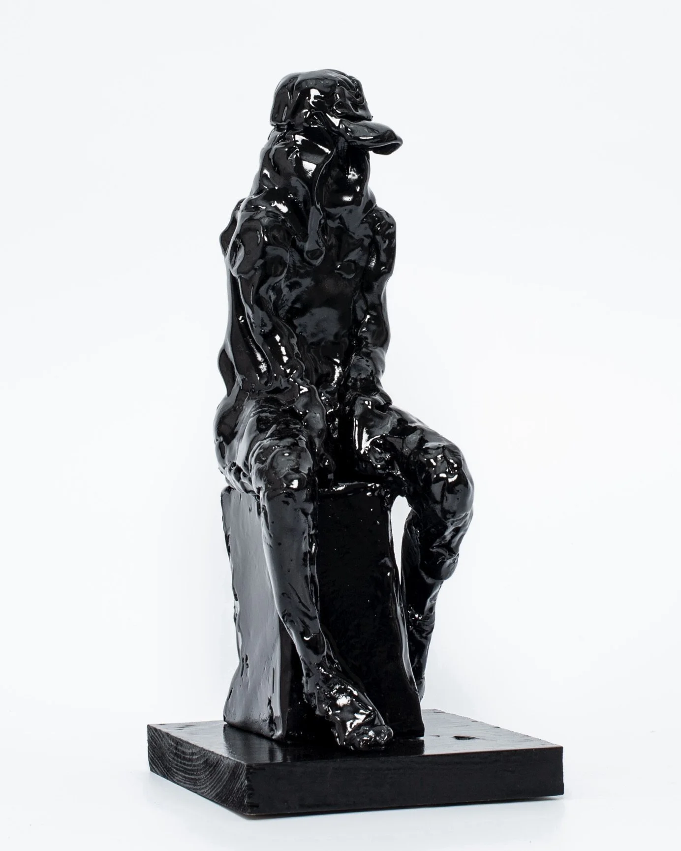 Seated figure in hoody with cap (study for a statue in splendid isolation)