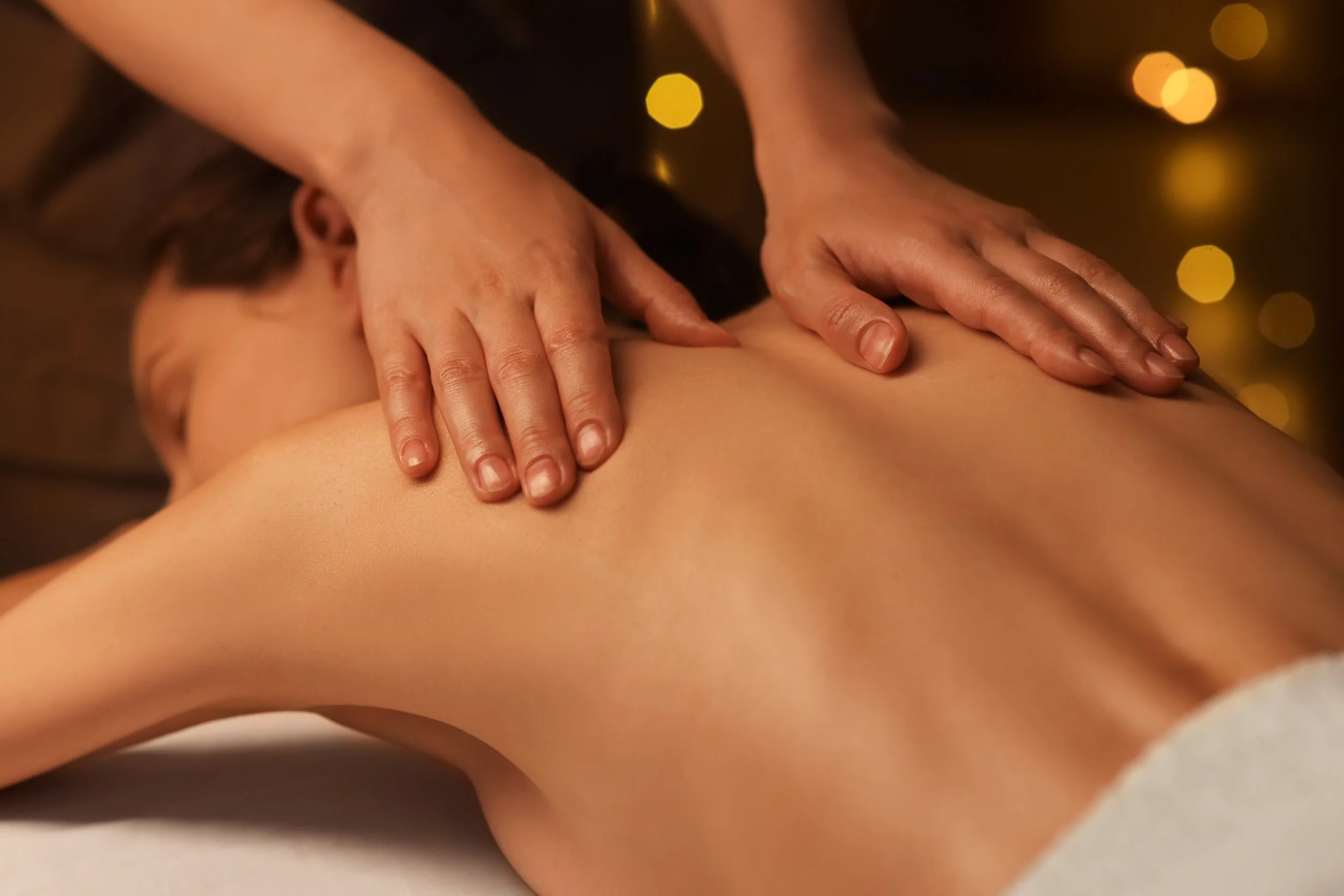 woman receiving therapeutic massage.