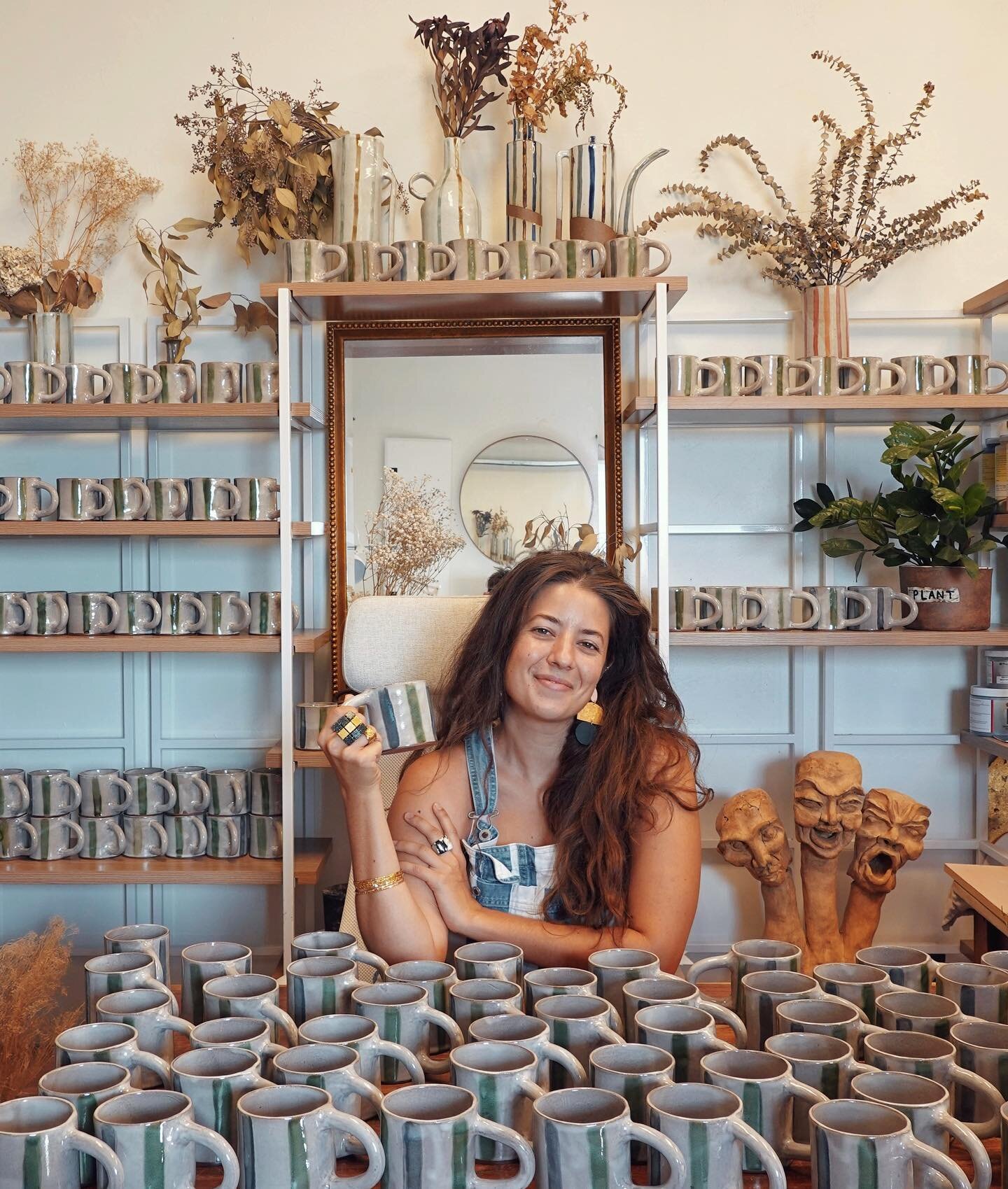 Me and the 100+ mugs @sweetgreen asked me to make for their first Austin opening in partnership with @neworiginshop !!!!!!! 

Austin friends: Get one for FREE by being one of the first 100 people to order through their app this Friday&mdash;and you&r