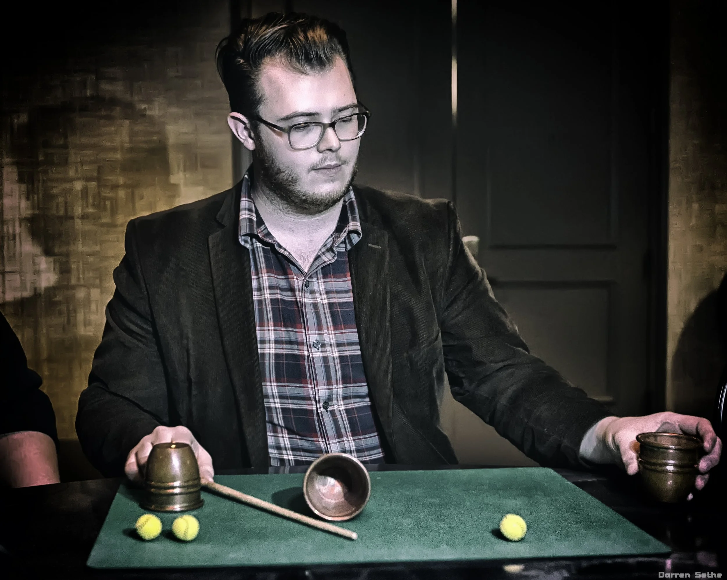 Jordan shows off his cup and balls routine 2019 (photo by Darren Sethe)
