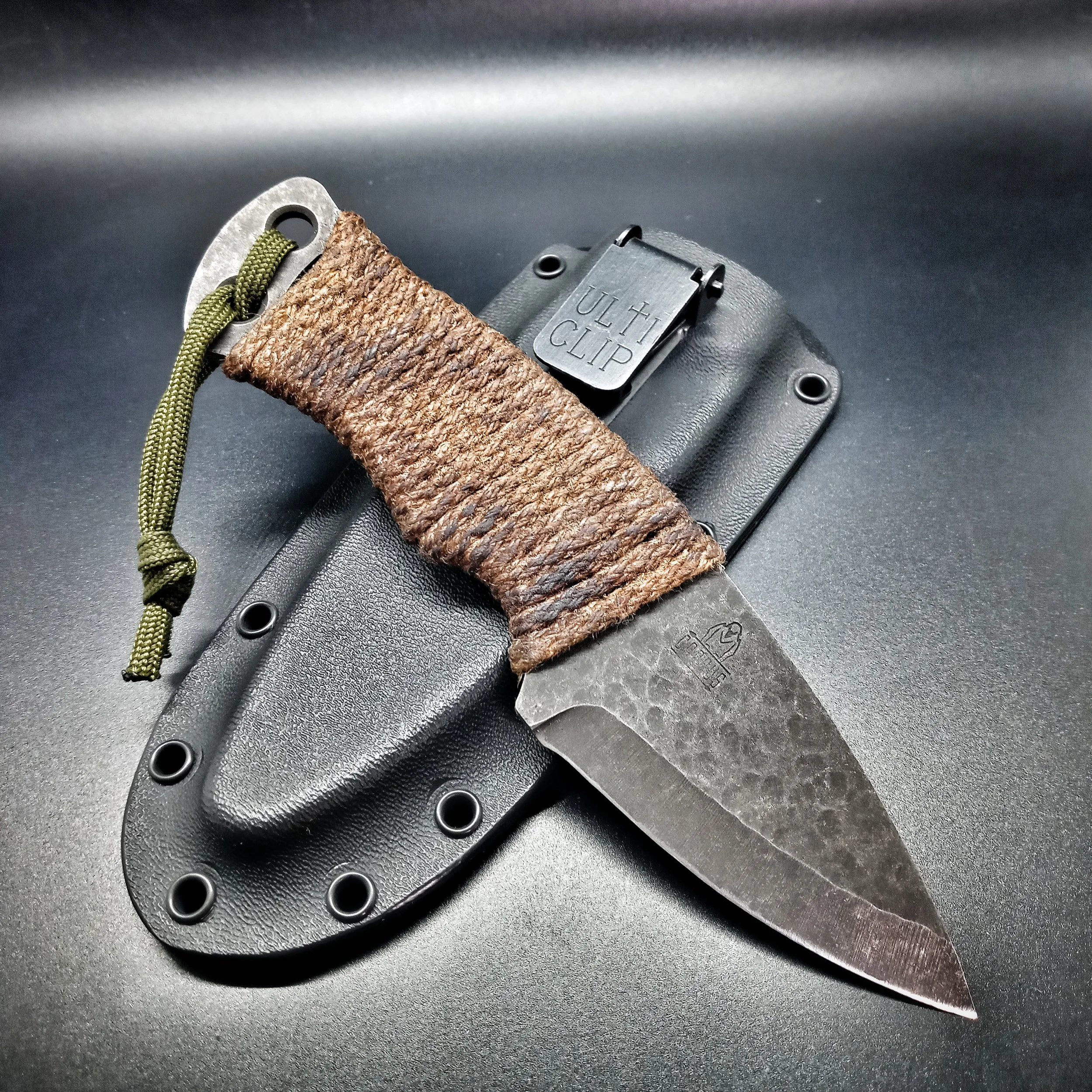 A knife resting on its sheath.