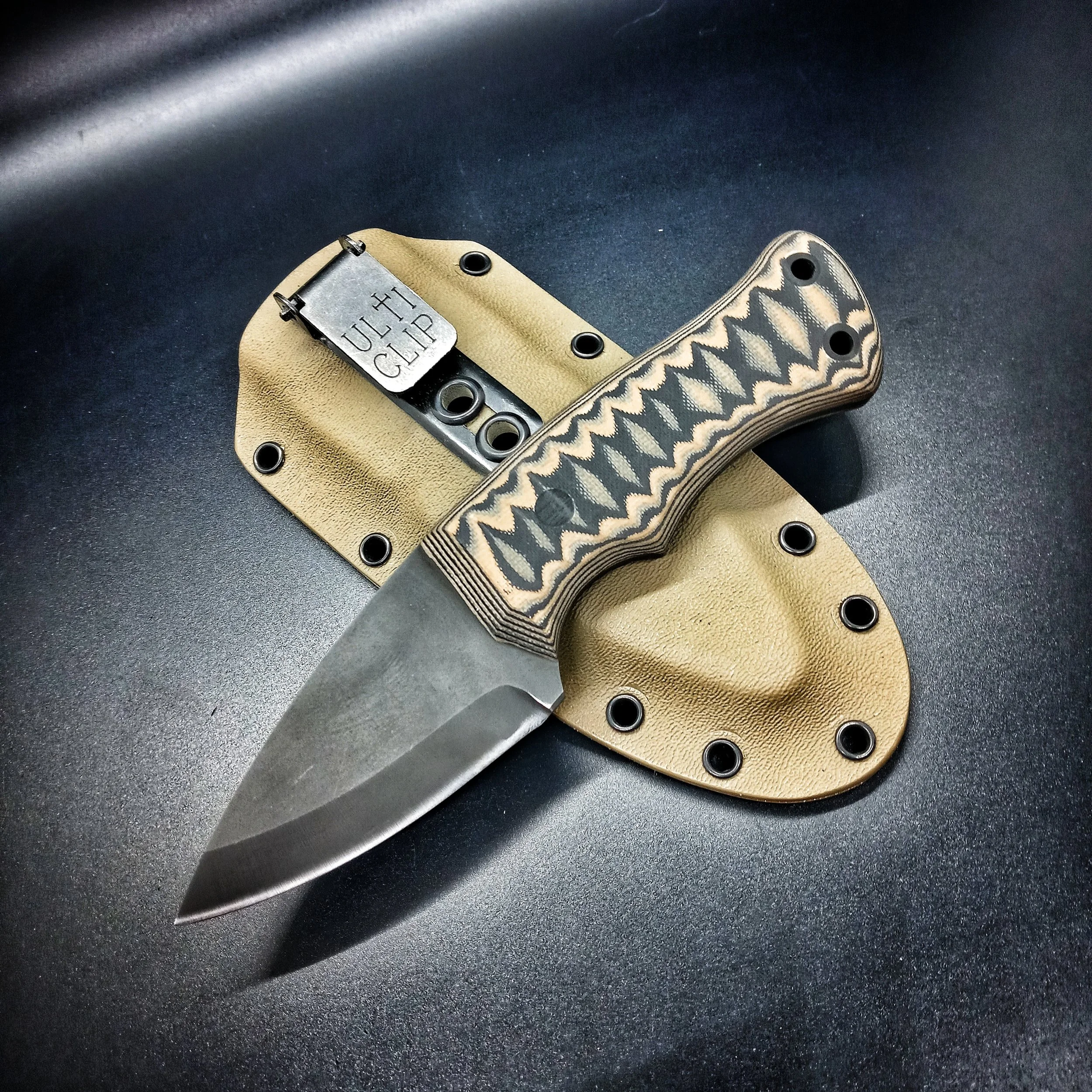 A knife resting on its sheath.