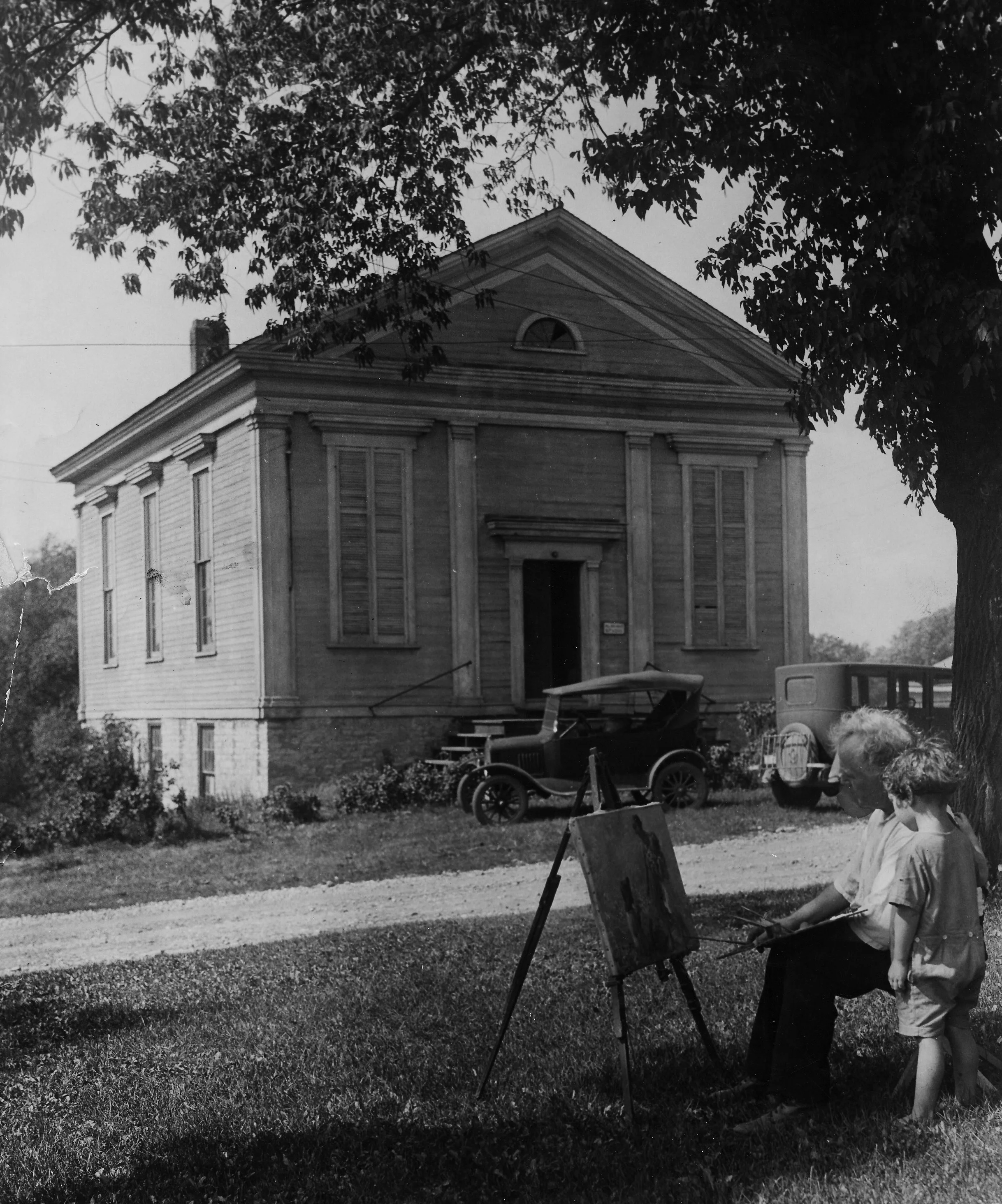 Adam painting outside Albright Building Museum.jpg