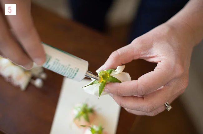 Step 5 : Apply a dollop of cold glue to the bottom of the cut flower (do this slowly as the cold glue has a tendency to run at first). Allow the glue to set up for 10-20 seconds.