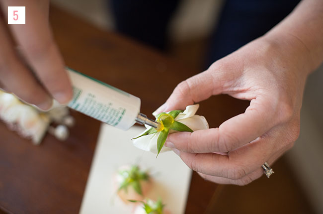 Step 5: Apply a dollop of cold glue to the bottom of the cut flower (do this slowly as the cold glue has a tendency to run at first). Allow the glue to set up for 10-20 seconds.