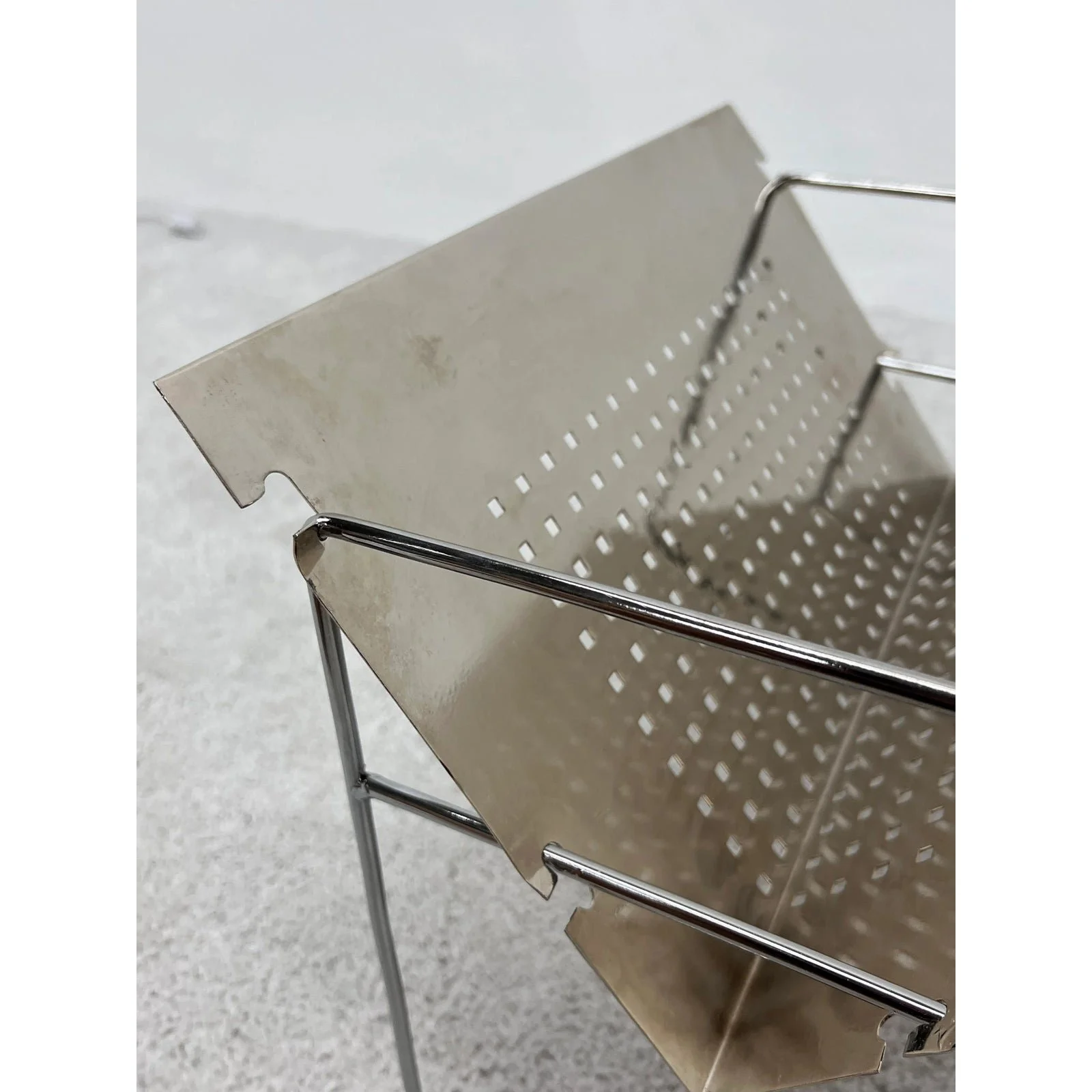 mid-century-brazilian-modern-perforated-chrome-magazine-rack-1960