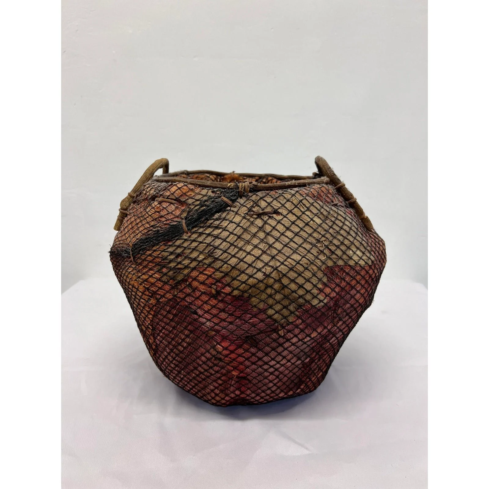 handmade-natural-fiber-and-leaf-basket-wrapped-in-fish-net-1970s-5910