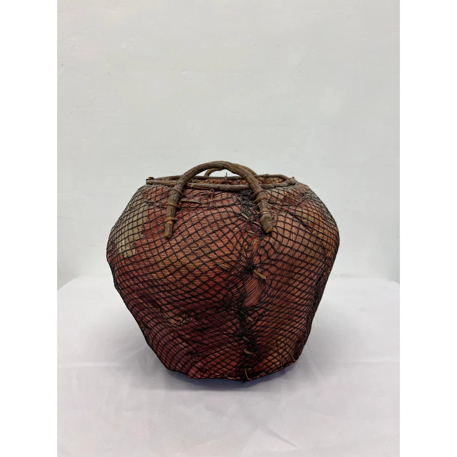 handmade-natural-fiber-and-leaf-basket-wrapped-in-fish-net-1970s-2160