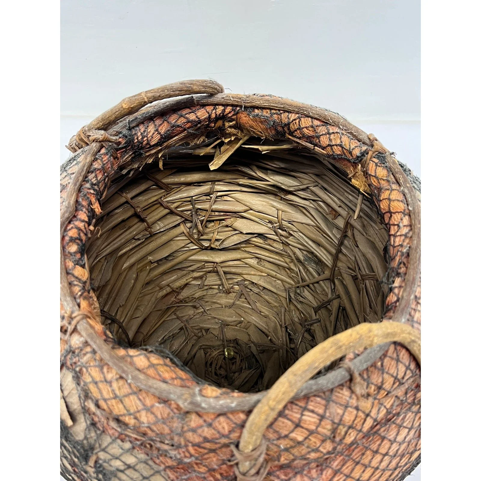 handmade-natural-fiber-and-leaf-basket-wrapped-in-fish-net-1970s-6512