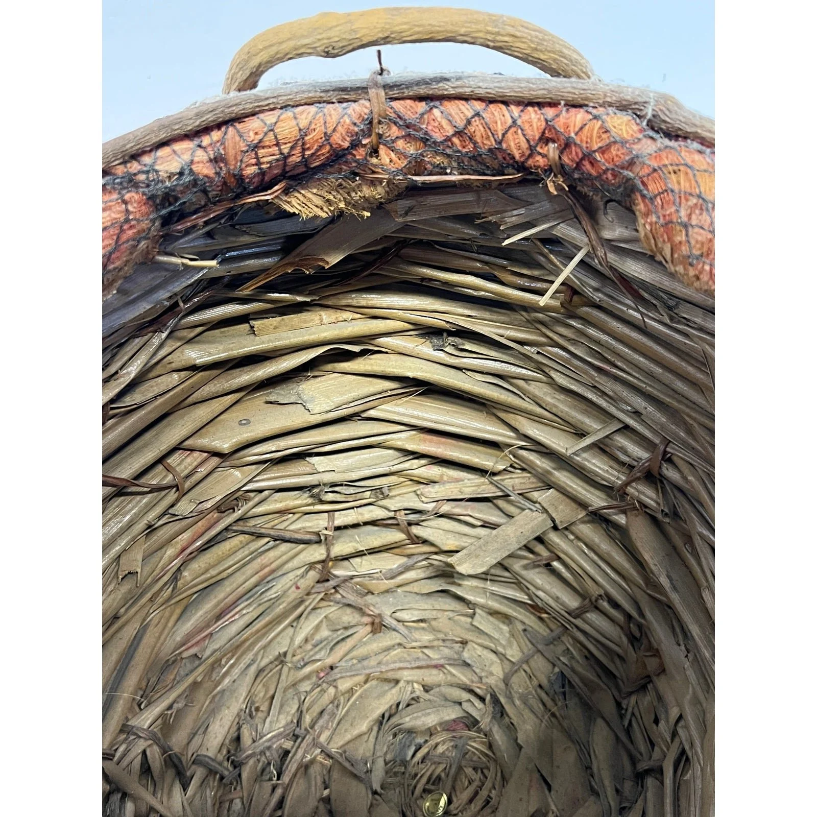 handmade-natural-fiber-and-leaf-basket-wrapped-in-fish-net-1970