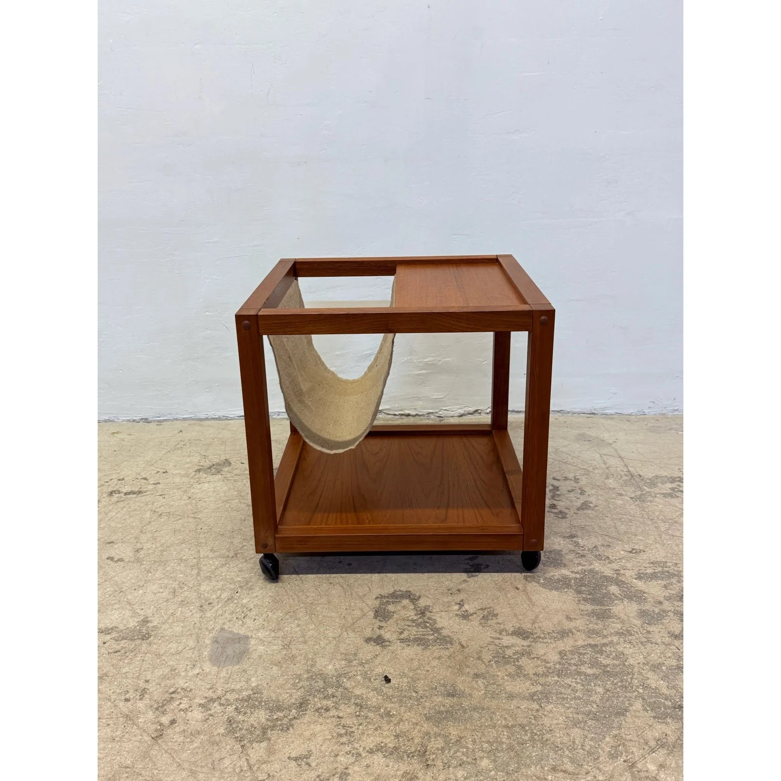 mid-century-danish-modern-teak-wood-rolling-end-table-with-magazine-or-book-holder-2103