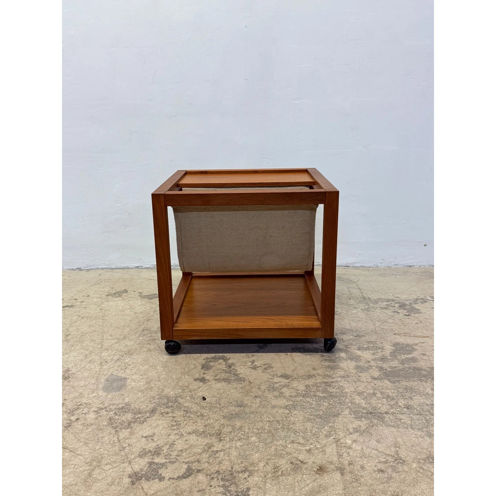 mid-century-danish-modern-teak-wood-rolling-end-table-with-magazine-or-book-holder-2919