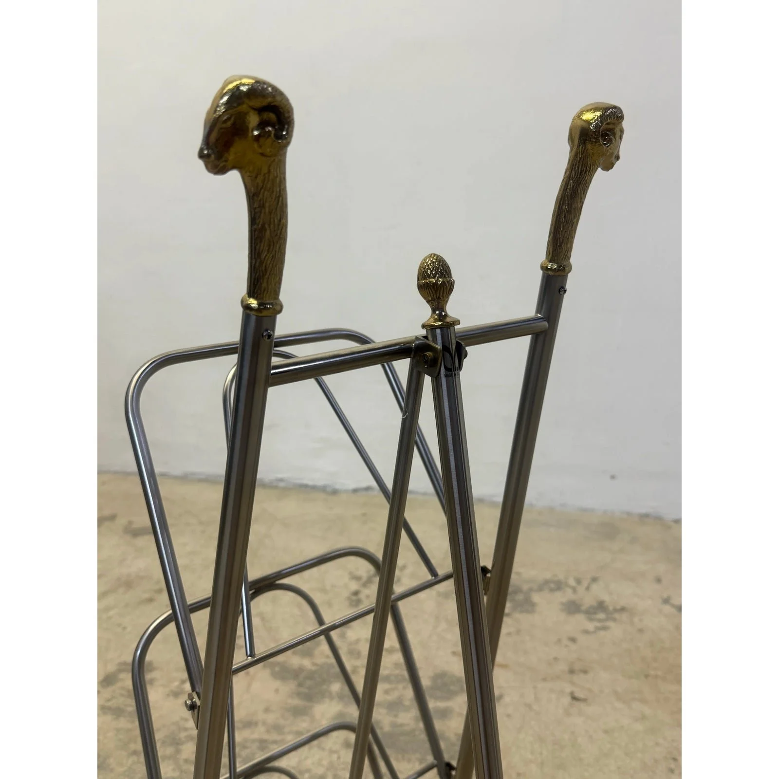 maison-jansen-style-steel-and-brass-rams-head-and-feet-magazine-rack-italy-1984