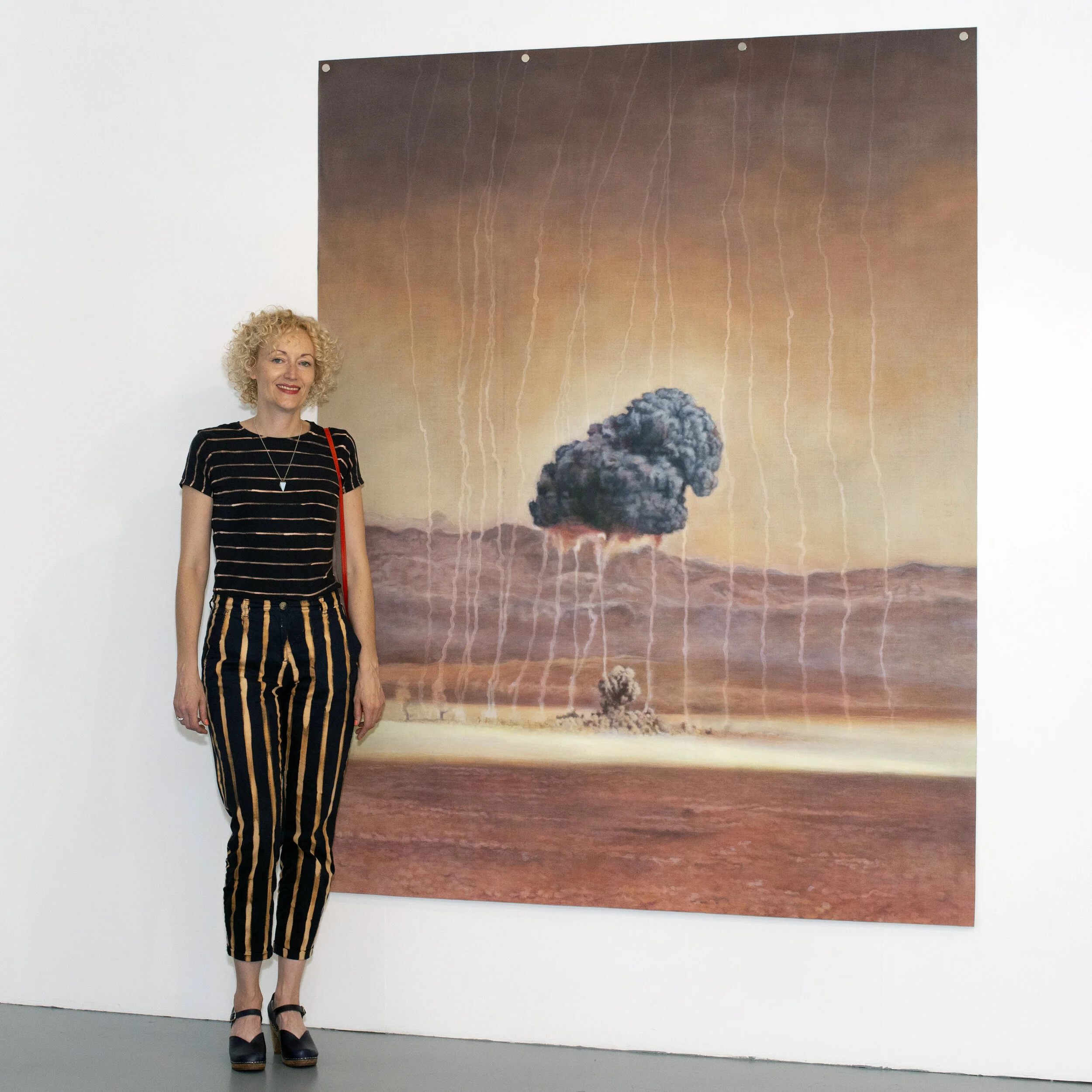 Kirsty Harris with her painting, Ranger Able, at the preview of her exhibition, ‘A Foul and Awesome Display’, Vane 2019.