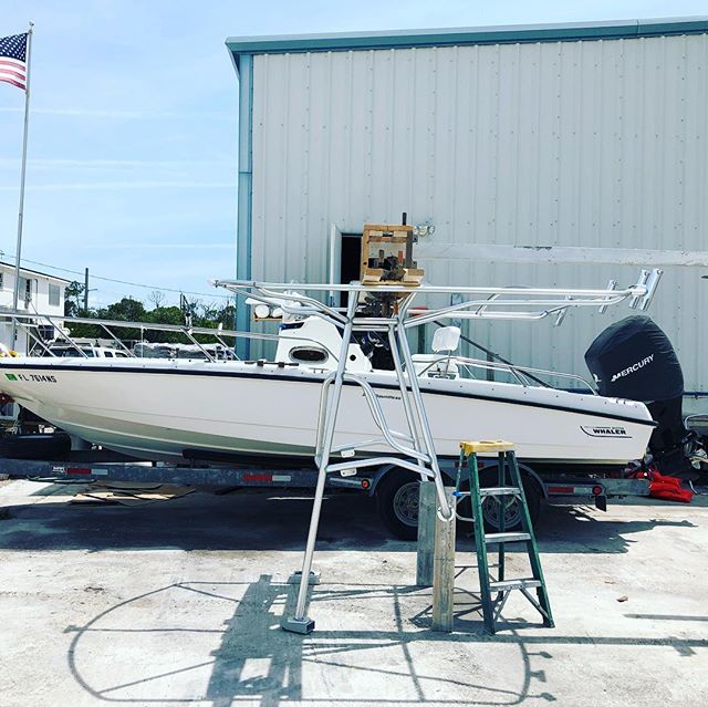 T-top install on a whaler. Somehow Ol&rsquo; Glory squeezes her way in there! #murica #bostonwhaler #customfabrication #aluminumwelding #flkeys