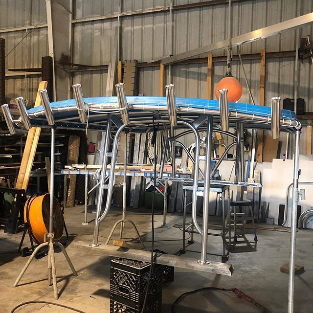 From shop to boatyard. This extra large double bow t-top with 8 rod holders and outrigger plates went on smooth! What do you guys think? #custom #aluminumfab #hydrocat #murica #shermanmarinetower #flkeys