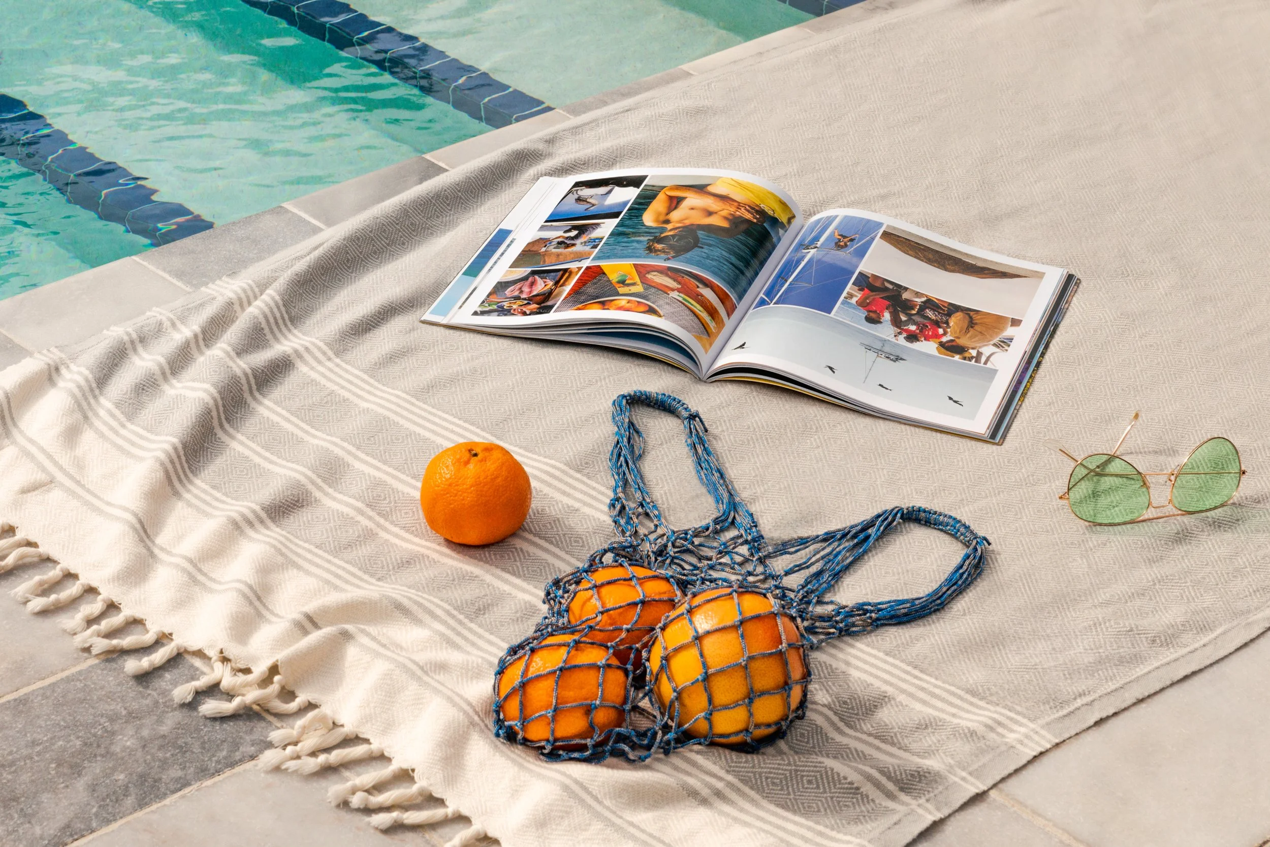 MIAMI HOTEL POOL SCENE WITH SUMMER MAGAZINE