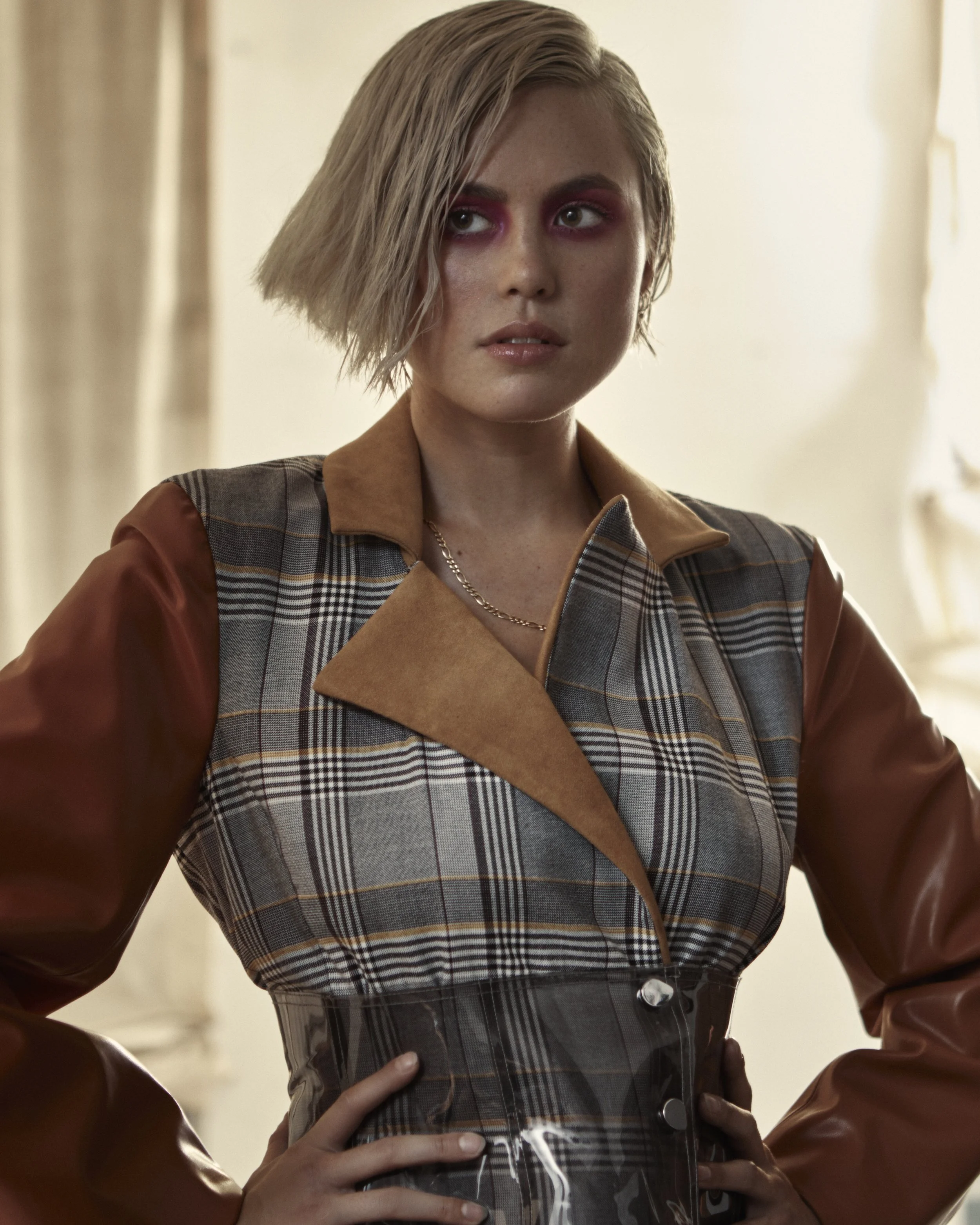 Wet look styling gives this tapered razor cut blonde bob a sultry finish.