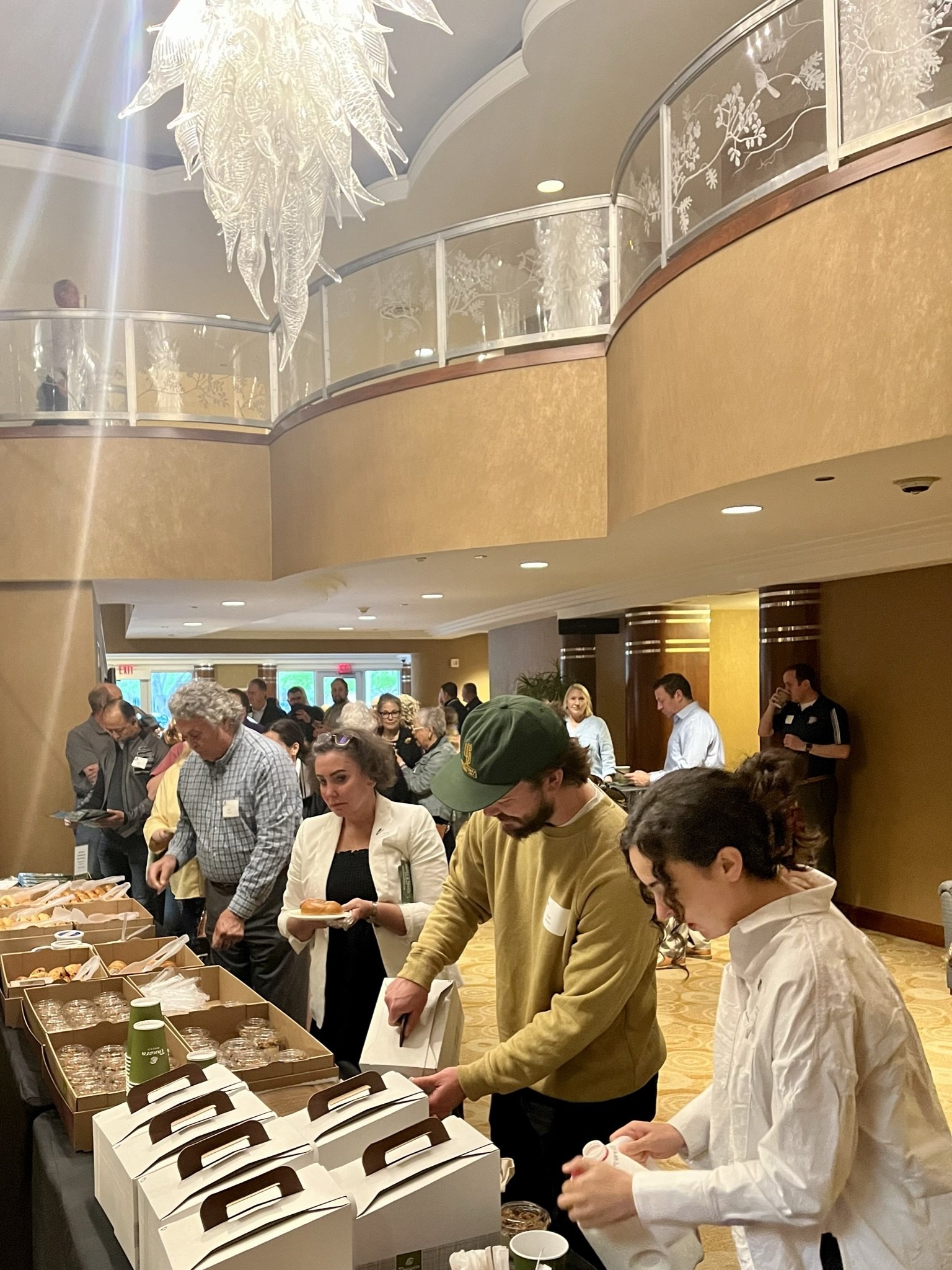 Attendees enjoy breakfast in the museum lobby before the program.JPEG