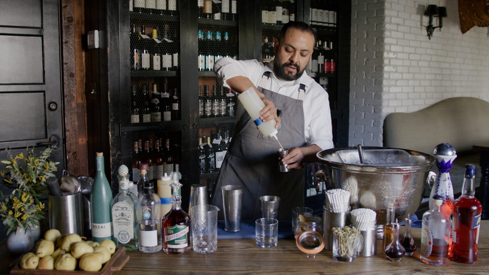 Bartender Ignacio Murillo makes a Bartlett Sour Cocktail at A.O.C.