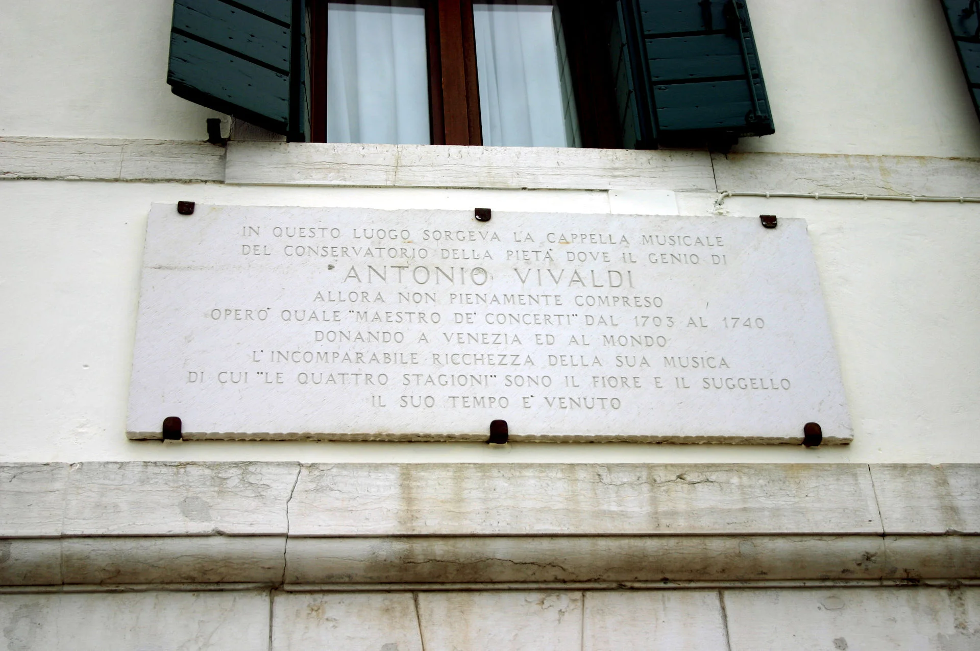 Commemorative plaque beside the Ospedale della Pietà (Devout Hospital of Mercy) in Venice.