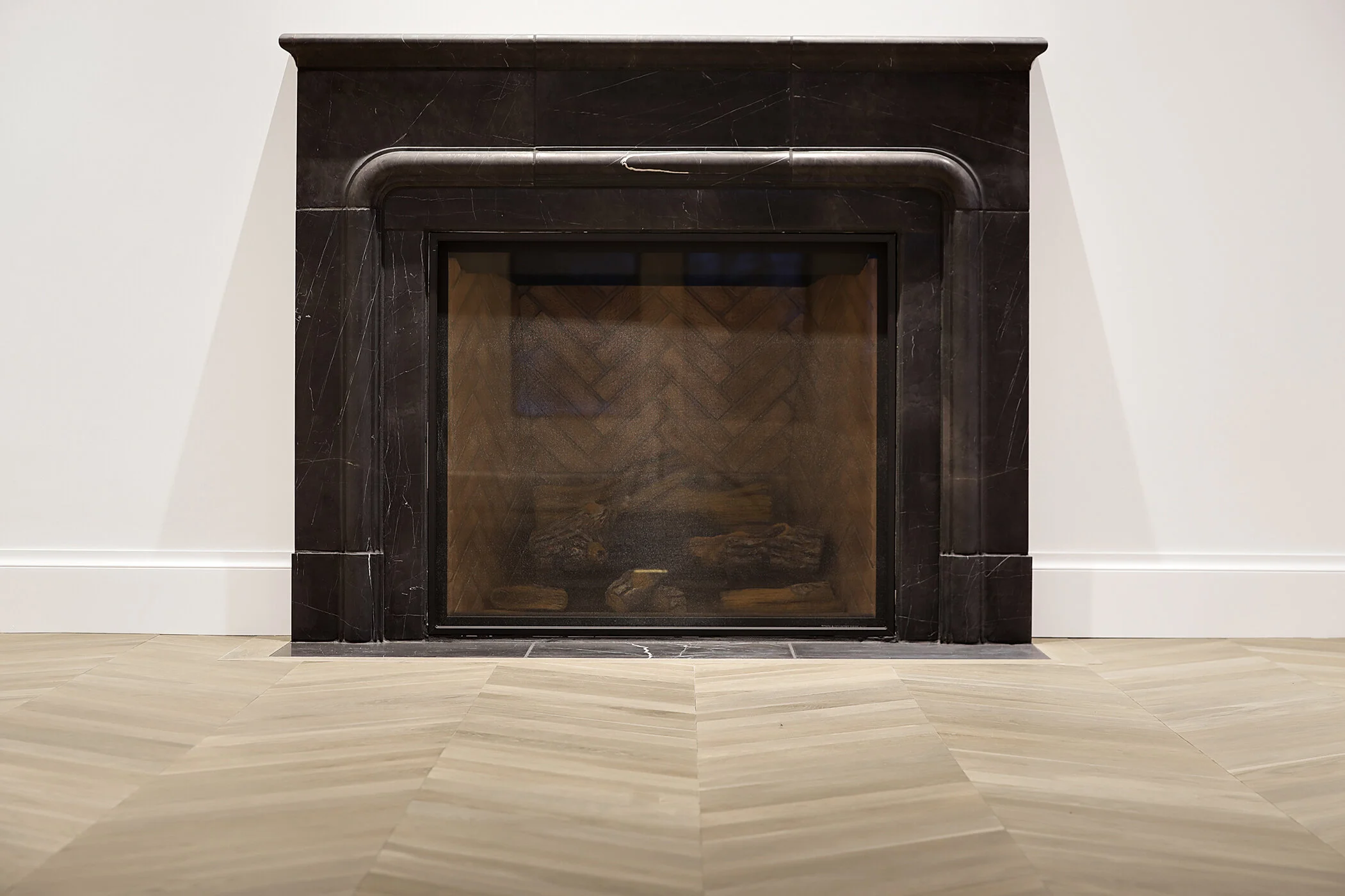 #taracaindesign #interiordesign #interiordesigner #design #interiors #archdigest #elledecor #modernarchitecture #architecture #luxury #inspiration #style #instagood #minneapolis #minneapolis #twincities #minnesota #home #custom #texture #whiteoak #whiteoakfloor #chevronfloor #whitewalls #styling #interiorstyling #blackwindows #fireplace #marble #marblefireplace #fireplacesurround #blackmarble #livingroom