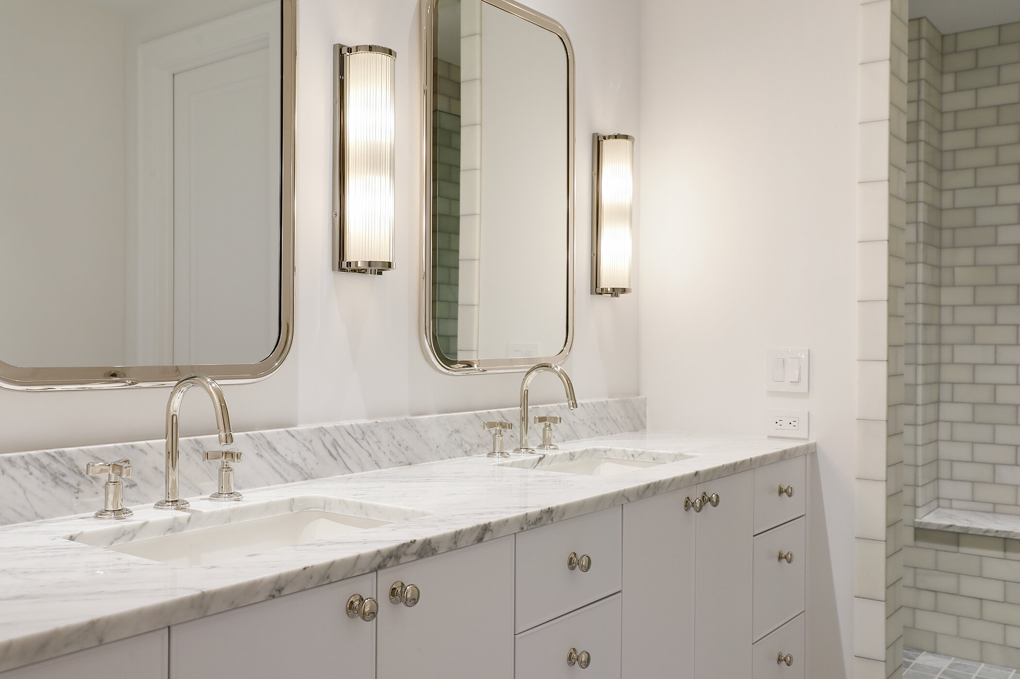 #taracaindesign #interiordesign #interiordesigner #design #interiors #archdigest #elledecor #modernarchitecture #architecture #luxury #inspiration #style #instagood #minneapolis #minneapolis #twincities #minnesota #home #custom #texture #whiteoak #whiteoakfloor #chevronfloor #whitewalls #styling #interiorstyling #blackwindows #bathroom #marble #marblecountertop #whitecabinets #sconce #faucet #nickel #shower