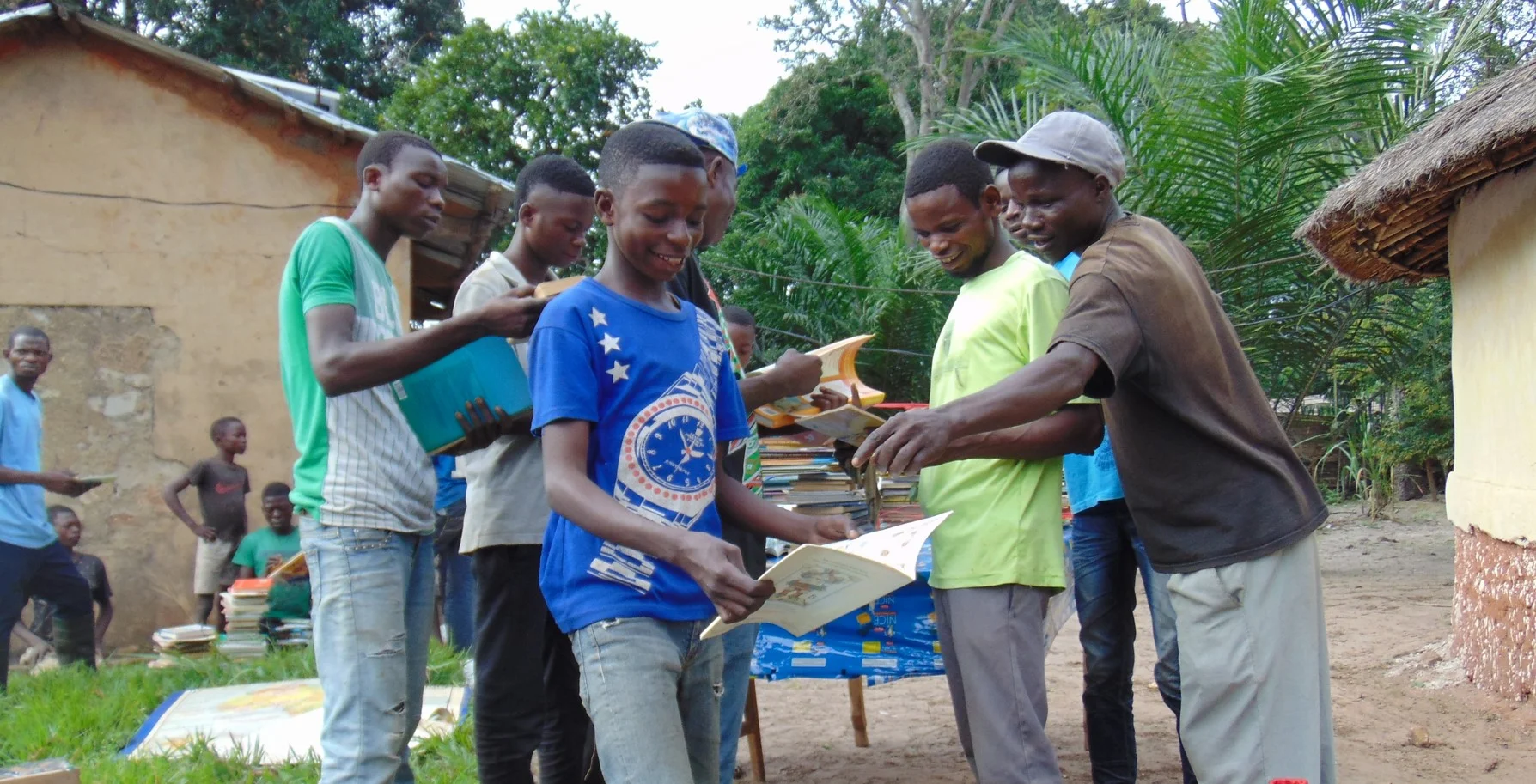 Photo caption: Many children in Kandale go through life without ever owning a book or reading one. The new library is putting a huge smile on the faces of Kandale’s readers.