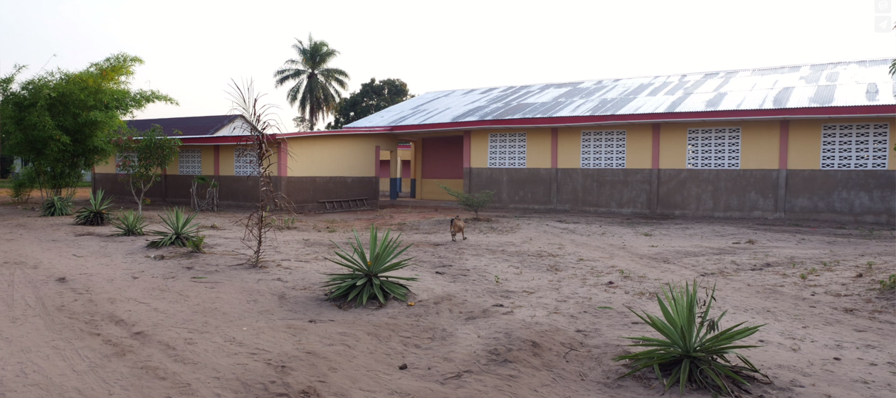 Multi-purpose building equipped with solar panels and two wings to house the library and the sewing program - 2018