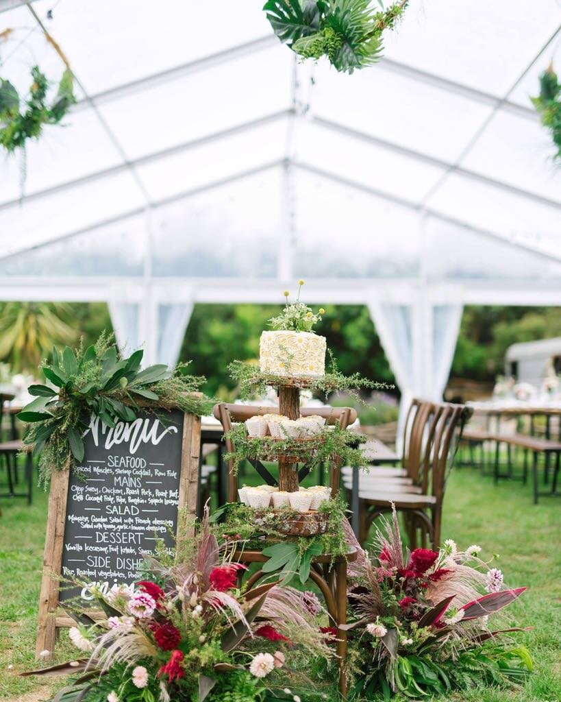 cake and flowers in tent.jpg