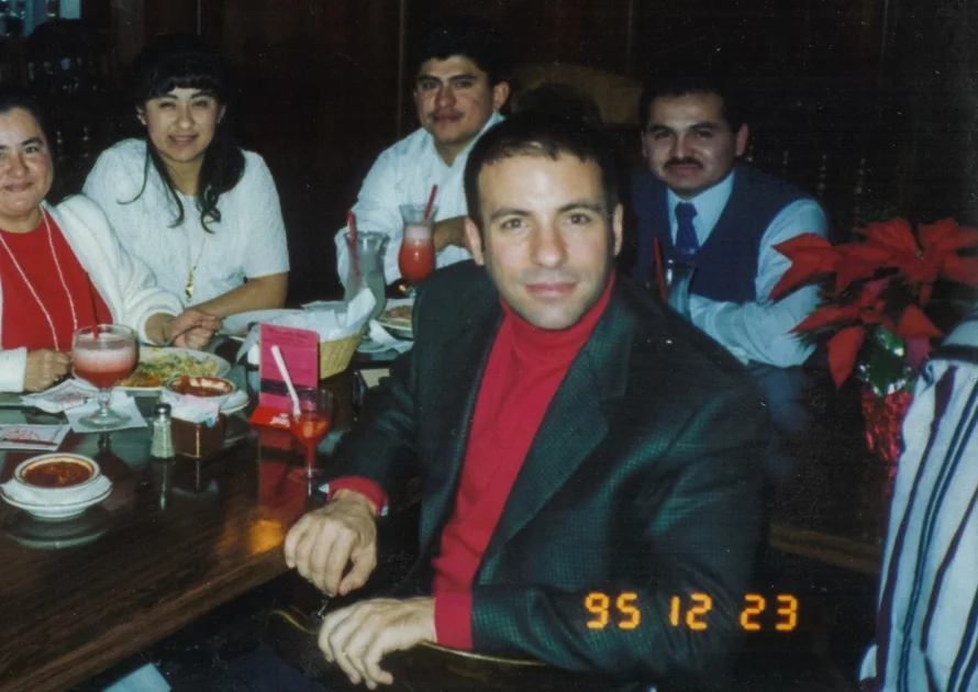 Vaughan Benz Christmas party, 1995. David (center) with our Controller, Marcial (right).