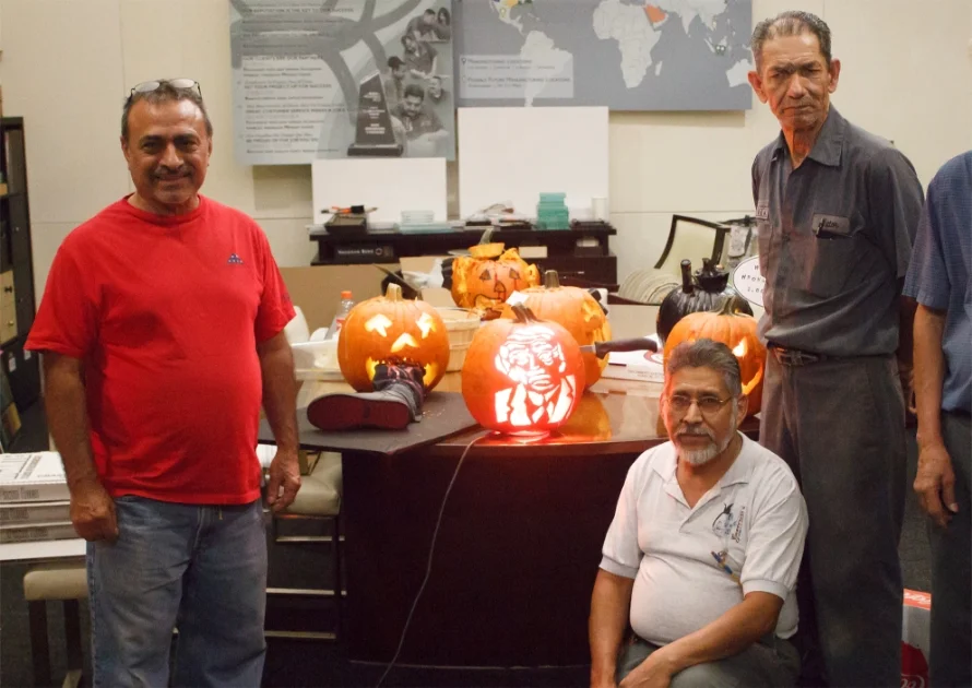 Vaughan Benz pumpkin carving contest, 2016. From left to right: current Senior Carpenter Alfredo Sr., Carpentry Manager Hugo, and former Senior Carpenter, Colombia.